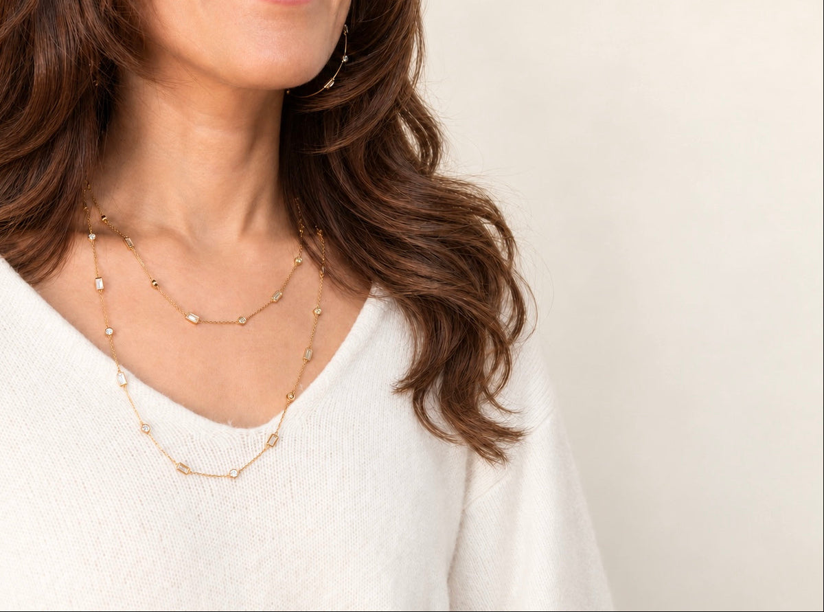 Woman wearing the delicate A. Atelier Signature Long Necklace doubled into two layers.