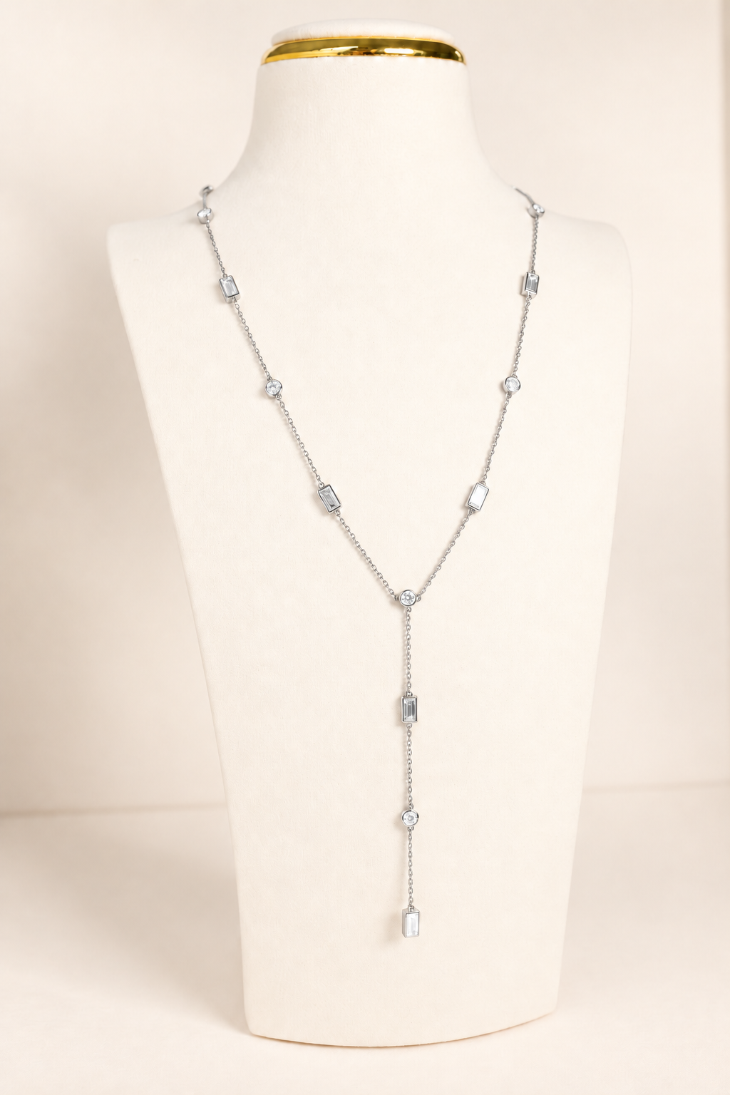 Delicate A. Atelier Signature Lariat in 18K white gold with alternating round and baguette diamonds and a cascading drop.