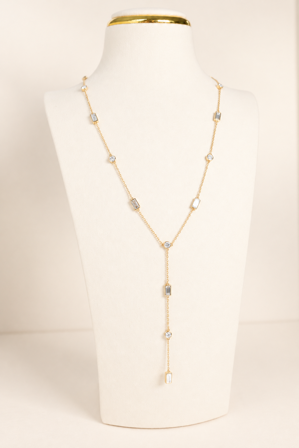 Delicate A. Atelier Signature Lariat in 18K yellow gold with alternating round and baguette diamonds and a cascading drop.