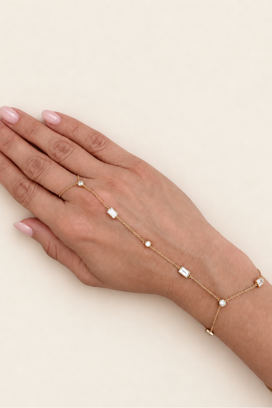 Delicate A. Atelier Signature yellow gold diamond hand chain worn across the back of a hand.